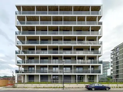 a car parked in front of a tall building at Prague Days - Modern Apartment with Terrace and AC in Karlín in Prague