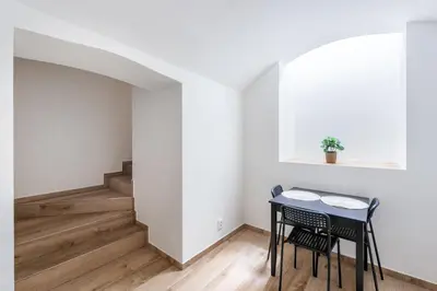 a dining room with a table and two chairs at Milano Apartment in Prague