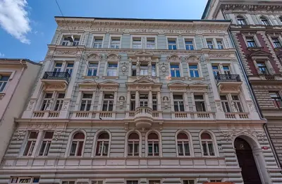 a tall building with a lot of windows at Milano Apartment in Prague
