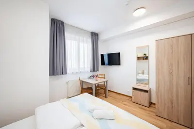 a kitchen with a microwave sitting inside of cabinets at University Hotel in Prague