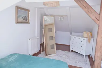 a bedroom with a mirror and a bed and a dresser at bohemian symphony in Prague
