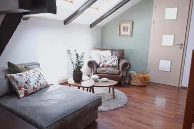 a living room with a couch and a table at bohemian symphony in Prague