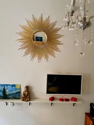 a living room with a tv and a mirror at AUTHENTIC Vyšehrad-2BR-Near CONGRES center-Riverside to the center in Prague