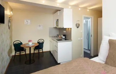 a small kitchen and a small table in a room at 4 Arts Apartments by Adrez in Prague