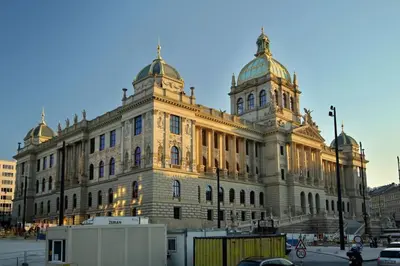 a large building with a tower on top of it at Beautiful apartment near Muzeum in Prague