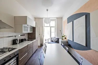 a kitchen with a white counter top in a room at Unique stylish apartment - L3 in Prague