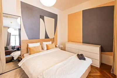 a bedroom with a large white bed in a room at Unique stylish apartment - L3 in Prague