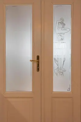 a door with a drawing of a woman on it at Apartment O21 by Interhome in Prague