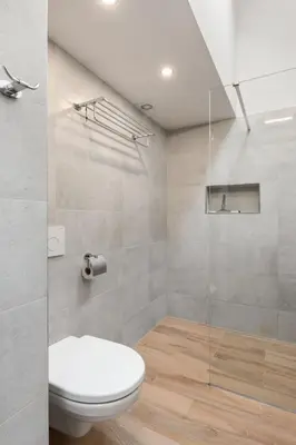 a bathroom with a toilet and a glass shower at Apartment O21 by Interhome in Prague