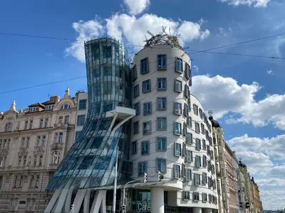 a tall white building with a glass facade at Apartment O21 by Interhome in Prague