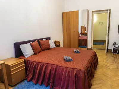 a small bedroom with a bed with two stuffed animals on it at Apartment Manes Residence by Interhome in Prague