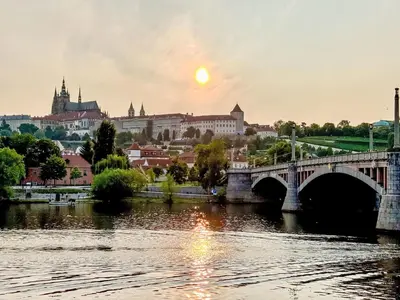 a bridge over a river with a city in the background at Apartment Manes Residence by Interhome in Prague