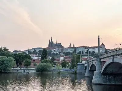 a bridge over a river with a city in the background at Apartment Manes Residence by Interhome in Prague