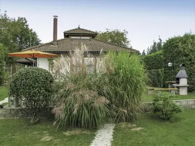 a house with a garden with tall grass at Villa Petříkov by Interhome in Petříkov