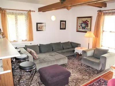 a living room with a couch and a table at Villa Petříkov by Interhome in Petříkov