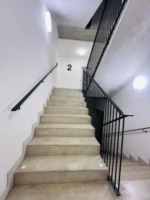 a staircase in a building with the number on the wall at Vikys Apartment in Prague