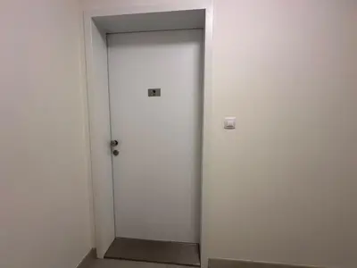 a door in a room with a white wall at Vikys Apartment in Prague
