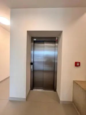 an elevator in a building with its door open at Vikys Apartment in Prague