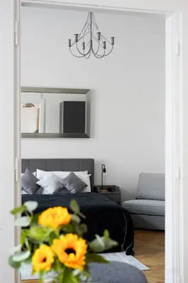 a bedroom with a bed with yellow flowers in it at Apartment Dusni Superior in Prague