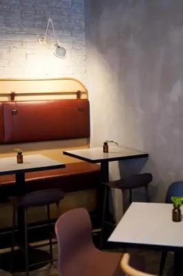 a row of tables and chairs in a restaurant at Apartment Dusni Superior in Prague