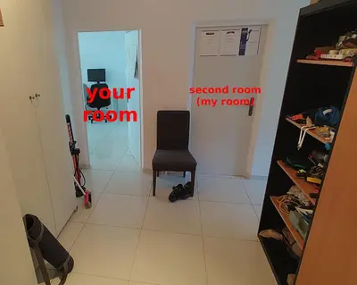a room with a chair and a room with a door at Nomads room nearest forest Kamýk in Prague