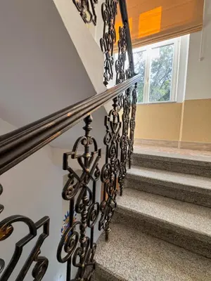 a set of stairs with wrought iron railings at Arbes 11 in Prague
