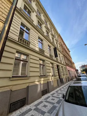 a white car parked in front of a building at Arbes 11 in Prague