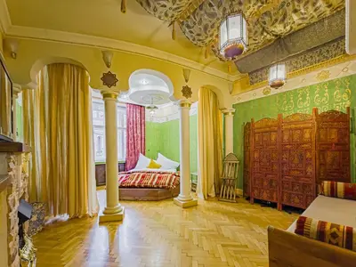 a large room with a bed and a couch in it at 1000 and 1 night in Prague city center in Prague
