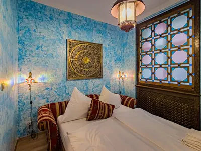 a bedroom with a white bed and a window at 1000 and 1 night in Prague city center in Prague