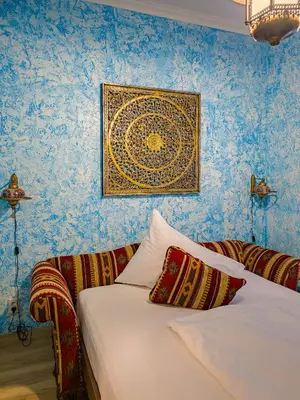 a bedroom with a bed and a painting on the wall at 1000 and 1 night in Prague city center in Prague