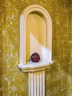 a vase sitting on a window in a wall at 1000 and 1 night in Prague city center in Prague
