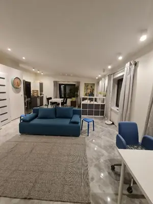 a living room with a blue couch and blue chairs at Airport Private Apartment, Advance Registration, No Reception, Self Check-in, Calm Environment, Non-Smoking Guests in Kněžívka