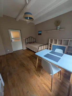 a white table and chairs in a living room at Airport Private Apartment, Advance Registration, No Reception, Self Check-in, Calm Environment, Non-Smoking Guests in Kněžívka