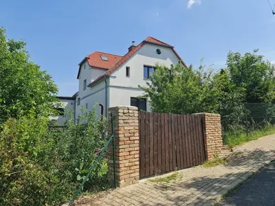 a house with a fence in front of it at Airport Private Apartment, Advance Registration, No Reception, Self Check-in, Calm Environment, Non-Smoking Guests in Kněžívka