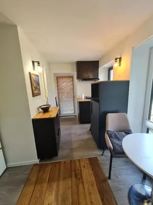 a wooden deck with a door in a building at Airport Private Apartment, Advance Registration, No Reception, Self Check-in, Calm Environment, Non-Smoking Guests in Kněžívka