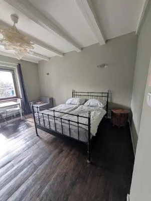 a bedroom with a bed with a yellow blanket on it at Airport Private Apartment, Advance Registration, No Reception, Self Check-in, Calm Environment, Non-Smoking Guests in Kněžívka