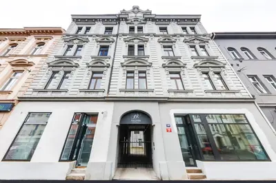 a white building on a city street at One bedroom Apartment at Sokolovska in Prague