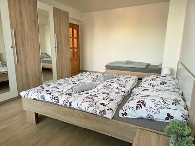 a bedroom with two beds in a room at Apartment in center of Poděbrady in Nymburk