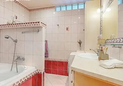 a bathroom with a sink and a shower and a toilet at Apartment in center of Poděbrady in Nymburk