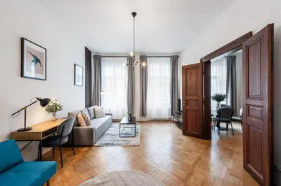 a living room with a couch and a table at Prague City vibe apartment in Prague