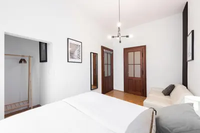 a kitchen and dining room with a table and chairs at Prague City vibe apartment in Prague