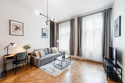 a living room with a couch and a table at Prague City vibe apartment in Prague