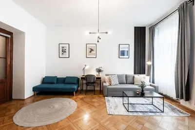 a living room with a couch and a table at Prague City vibe apartment in Prague