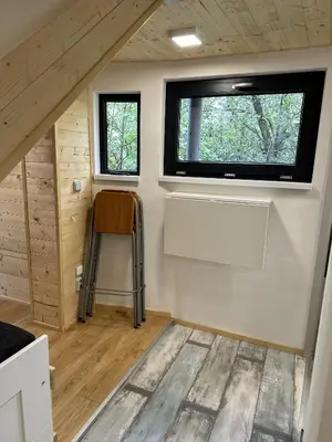a view of a tiny house with a window at Mini Apartman - G - Vyhlídka nad řekou in Zámky
