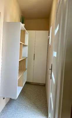 a room with a white cabinet and a door at Apartmán Dominikánská in Litoměřice