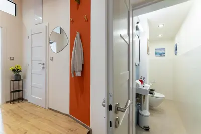 a bathroom with a toilet and a sink at Classy Loft Apartment in the City Center of Prague in Prague