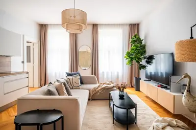 a living room with a couch and a tv at 3BR & 2,5Bath Heaven of Harmony 2 Theater VIEW in Prague