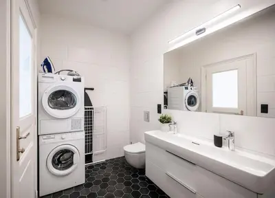 a white bathroom with a washing machine and a sink at 3BR & 2,5Bath Heaven of Harmony 2 Theater VIEW in Prague