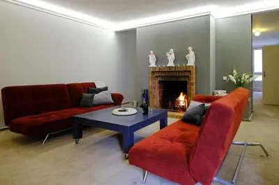 a dining room with a table and chairs at ViDa Prostorný 220 m2 3BR Apartmán s Krbem a Zahradou, Ideální pro Rodiny in Prague