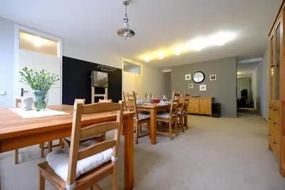 a bedroom with a large bed and a large window at ViDa Prostorný 220 m2 3BR Apartmán s Krbem a Zahradou, Ideální pro Rodiny in Prague